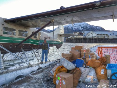 Pilot Clark Hassell unloading freight in Metlakatla