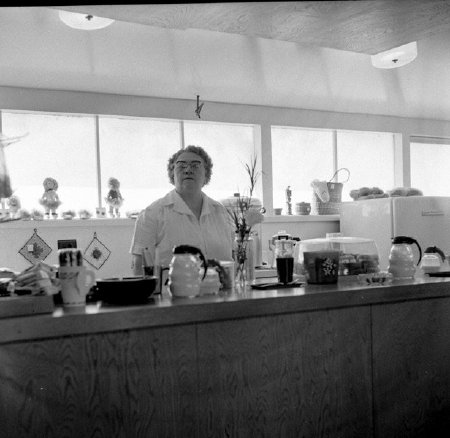 Gerde Bjorgen works the Pacific Northern Airlines counter