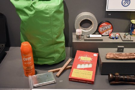 Survival kit display in Into the Wind exhibit