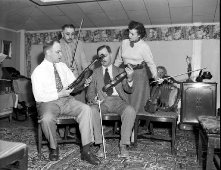 Examining the violin made by Charles Gengler