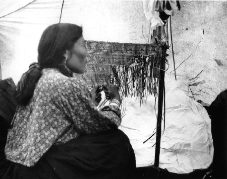 Weaving a cedar bark mat at Kasaan, 1902