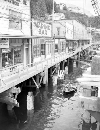 Construction worker in skiff on Water Street