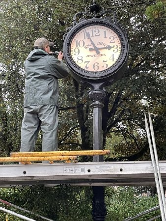 Daryl Hert making repairs to the Billingsley Clock in Whale Park, 2023
